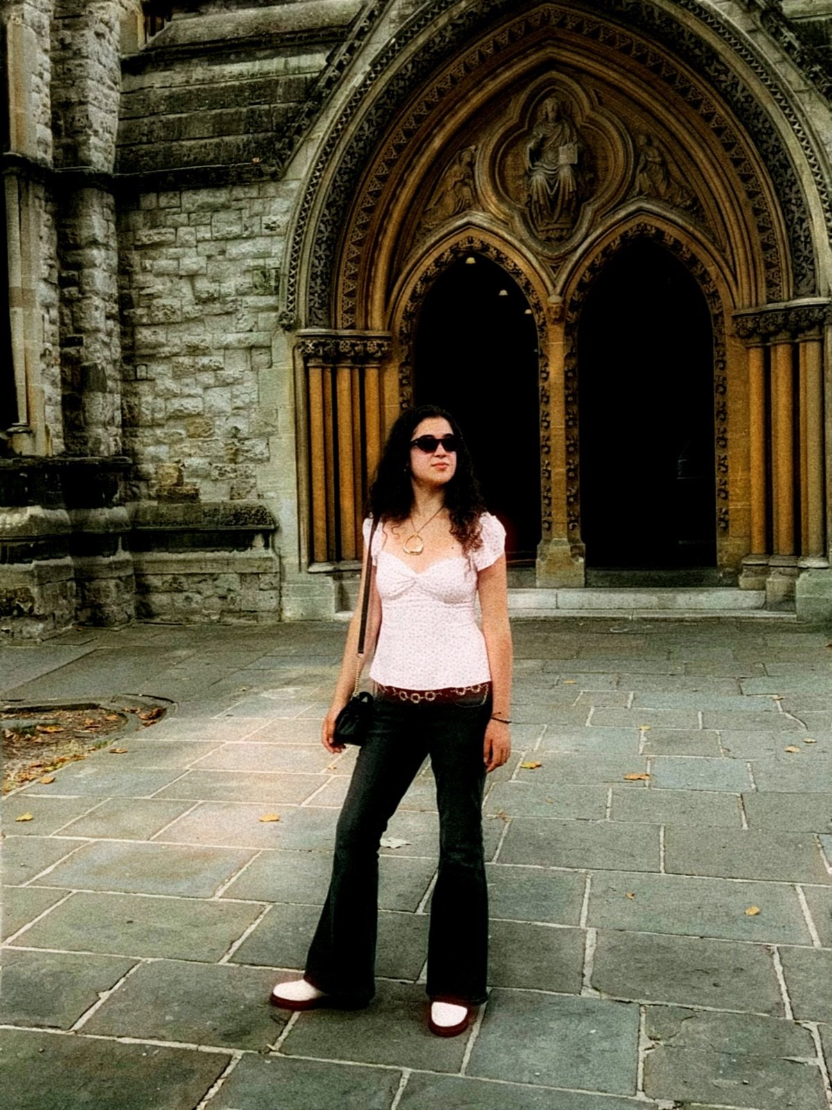 Rosie in front of a cathedral archway